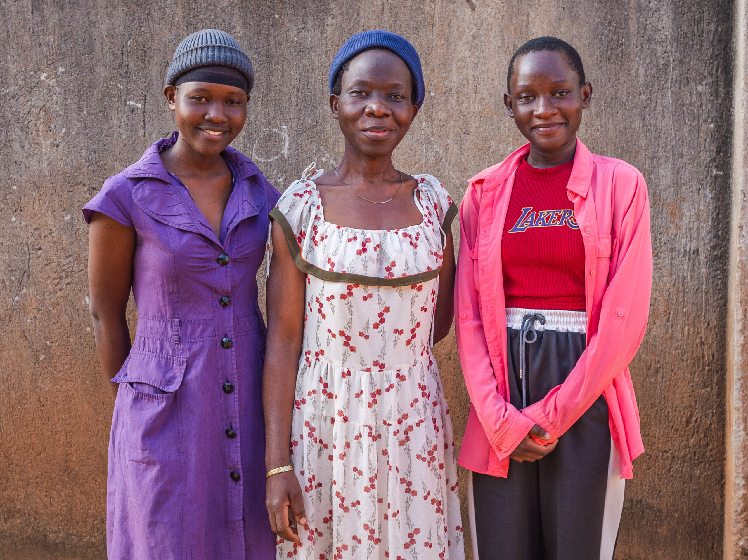 Lyton in pink, her mother in the middle and sister in purple.